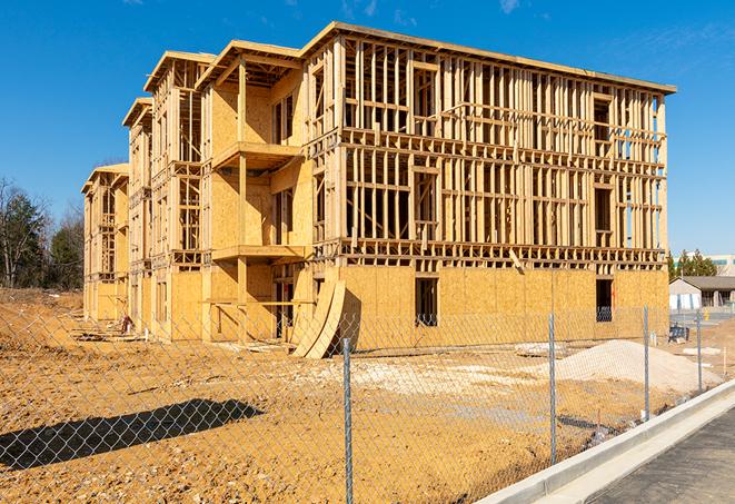 construction zone secured with a temporary fence, marked with warning signs in Barnegat, NJ